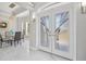 Elegant entryway with decorative glass doors, marble floors, and modern light fixtures at 3415 Tripoli Blvd, Punta Gorda, FL 33950