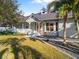 Charming home featuring a well-manicured lawn, inviting entrance, and lush landscaping at 3415 Tripoli Blvd, Punta Gorda, FL 33950