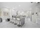 Contemporary kitchen features white cabinetry, a gray island with seating, and stainless steel appliances at 3415 Tripoli Blvd, Punta Gorda, FL 33950