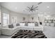 Bright living room featuring modern decor, a zebra rug, and an open floor plan to the kitchen at 3415 Tripoli Blvd, Punta Gorda, FL 33950