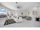 Open-concept living room with a fireplace, neutral decor, and large windows with outdoor views at 3415 Tripoli Blvd, Punta Gorda, FL 33950