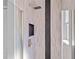 Walk-in shower with modern tile design, brushed gold shower head and built-in niche at 3415 Tripoli Blvd, Punta Gorda, FL 33950
