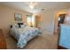 Bright bedroom with ceiling fan, tile flooring, and comfortable queen size bed at 4355 Boggs St, Port Charlotte, FL 33948