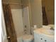 Bathroom featuring a shower and tub combo, toilet, and sink at 1247 Petronia St, North Port, FL 34286