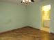 Bedroom with hardwood floors leading to en suite bathroom at 1247 Petronia St, North Port, FL 34286