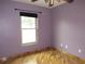 Bedroom with hardwood floors, window and neutral color at 1247 Petronia St, North Port, FL 34286