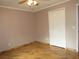 Bedroom featuring hardwood floors, closet and ceiling fan at 1247 Petronia St, North Port, FL 34286