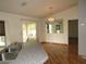Dining area with hardwood floors, modern lighting, and a view into the living space at 1247 Petronia St, North Port, FL 34286