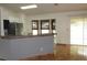 Bright kitchen with a breakfast bar, stainless steel appliances, and ample counter space at 1247 Petronia St, North Port, FL 34286