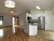 Expansive living space featuring a kitchen, living room, and modern appliances at 1247 Petronia St, North Port, FL 34286