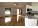 Open living space with hardwood floors, modern appliances, and natural light at 1247 Petronia St, North Port, FL 34286