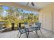 Relaxing screened patio with seating and views of lush landscaping at 1323 Jonah Dr, North Port, FL 34289