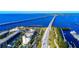 Aerial view of waterfront properties along the coast with beautiful bridge and ocean vistas at 1339 Casey Key Dr, Punta Gorda, FL 33950