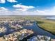 Panoramic aerial shot of a home on the water, surrounded by lush foliage, highlighted in red at 1339 Casey Key Dr, Punta Gorda, FL 33950