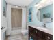 Bathroom with tile flooring, granite vanity, neutral paint, and shower and tub combination at 1339 Casey Key Dr, Punta Gorda, FL 33950
