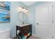 Bathroom with tile flooring, granite vanity, neutral paint, and built-in towel storage at 1339 Casey Key Dr, Punta Gorda, FL 33950