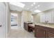 Bathroom with dual sinks, granite countertops, large mirror, and ensuite access at 1339 Casey Key Dr, Punta Gorda, FL 33950