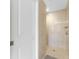 Walk-in shower with glass doors, modern fixtures, and neutral tile at 1339 Casey Key Dr, Punta Gorda, FL 33950