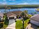 Stunning waterfront home boasts lush landscaping, a well-manicured lawn, and a private boat dock at 1339 Casey Key Dr, Punta Gorda, FL 33950