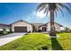 Charming single-story home with a stone facade, well-kept lawn, mature landscaping, and a two-car garage at 1339 Casey Key Dr, Punta Gorda, FL 33950