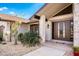 Inviting front entrance featuring double doors, stone accents, and lush landscaping enhancing curb appeal at 1339 Casey Key Dr, Punta Gorda, FL 33950