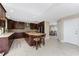 Open-concept kitchen with a central island, custom cabinetry, and ample counter space at 1339 Casey Key Dr, Punta Gorda, FL 33950