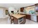 Spacious kitchen with island, stainless appliances, dark wood cabinets, open to living area at 1339 Casey Key Dr, Punta Gorda, FL 33950