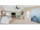 Bright living room with neutral tones, vaulted ceilings, and ample natural light at 1339 Casey Key Dr, Punta Gorda, FL 33950