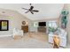 Bright living room with vaulted ceilings, comfortable seating, and stylish coastal decor creating a welcoming space at 1339 Casey Key Dr, Punta Gorda, FL 33950