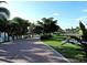 Scenic paved pathway lined with lush greenery and trees creating a peaceful atmosphere at 1339 Casey Key Dr, Punta Gorda, FL 33950