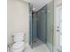 Contemporary shower with glass enclosure, sleek tiling, and modern fixtures for a spa-like experience at 1339 Casey Key Dr, Punta Gorda, FL 33950