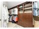 Spacious walk-in closet featuring custom shelves, drawers, and ample storage space at 1339 Casey Key Dr, Punta Gorda, FL 33950