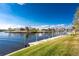 Scenic waterfront view with a private dock and lush green lawn at 1339 Casey Key Dr, Punta Gorda, FL 33950