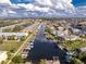 Scenic aerial view of waterfront community with boat docks, lush landscaping, and beautiful surrounding neighborhood at 2000 Bal Harbor Blvd # 1-111, Punta Gorda, FL 33950
