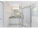 Bathroom featuring a glass shower, a large mirror, and a vanity with a granite countertop at 2000 Bal Harbor Blvd # 1-111, Punta Gorda, FL 33950