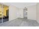 Bedroom with sliding door to patio and view to bathroom at 2000 Bal Harbor Blvd # 1-111, Punta Gorda, FL 33950