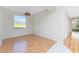 Spacious room with laminate floors, natural light, and a scenic outdoor view at 2000 Bal Harbor Blvd # 1-111, Punta Gorda, FL 33950