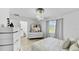 Bright bedroom with modern furnishings, stylish lighting, and a tranquil ambiance at 2325 Hanford Ln, North Port, FL 34288
