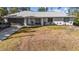 Charming single-story home with an attached two-car garage, beautiful landscaping, and ample curb appeal at 2325 Hanford Ln, North Port, FL 34288