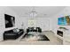Inviting living area with modern decor, comfortable seating, and a bright atmosphere at 2325 Hanford Ln, North Port, FL 34288
