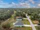 Aerial view of the home with the property lines showcasing the large backyard and neighborhood surroundings at 3264 Garbett Ter, North Port, FL 34288