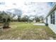 Expansive backyard with a playset, shed, and open green space, ideal for recreation and Gathering fun at 3264 Garbett Ter, North Port, FL 34288