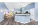 Kitchen and breakfast nook with bright yellow door and stainless steel appliances at 3264 Garbett Ter, North Port, FL 34288