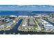 Stunning aerial view of waterfront condos, boat docks, and sparkling blue water, offering a glimpse of coastal living at 367 Coldeway Dr # H10, Punta Gorda, FL 33950