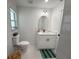 Bright bathroom with a modern vanity, stylish mirror, and neutral tile flooring at 4128 Durant St, Port Charlotte, FL 33948