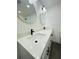 Bathroom featuring double vanity, stone countertops, modern fixtures and finishes, and updated lighting at 4128 Durant St, Port Charlotte, FL 33948