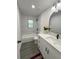 Updated bathroom featuring a tub and shower, modern vanity, and neutral color palette at 4128 Durant St, Port Charlotte, FL 33948