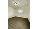 This bedroom features new laminate flooring and lots of light from one window at 4128 Durant St, Port Charlotte, FL 33948