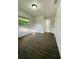 Bedroom with wood floors, a window, and a closet with sliding doors at 4128 Durant St, Port Charlotte, FL 33948