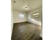Cozy bedroom with hardwood floors, neutral paint, ample natural light, and dual windows at 4128 Durant St, Port Charlotte, FL 33948